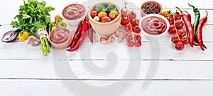 Preparation of tomato sauces and seasonings. Cherry tomatoes, spices, chili peppers. Top view