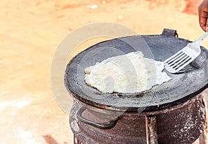 Preparation of traditional Ugandan breakfast Rolex made with cha photo