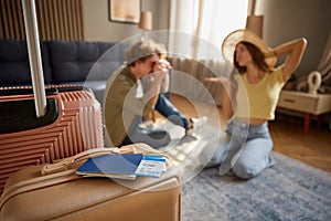 Preparation for trip concept with man shooting woman in straw hat