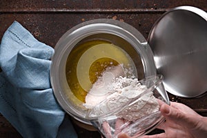 Preparation of veloute sauce on the wooden table top view