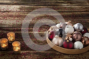 Preparation of warm Christmas eve with baubles and spiritual candlelights