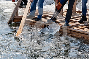 Preparation of winter ice-hole for swimming