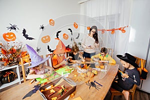 Preparations for autumn holidays doing craft with kids