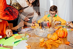 Preparations for autumn holidays doing craft with kids