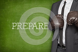 Prepare on blackboard with businessman on side