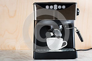 prepare a cup of coffee in espresso machine