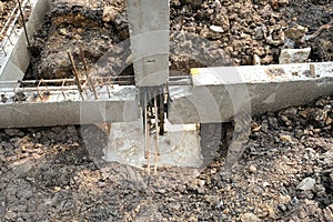 Prepare foundation pillar in pit before making joint concrete for reinforce structure in house site.engineer construction builder