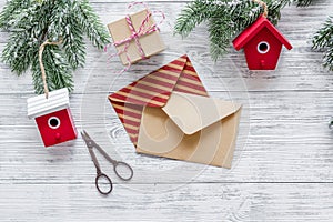 Prepare new year and christmas 2018 presents in boxes and envelopes on wooden background top veiw