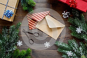Prepare new year and christmas 2018 presents in boxes and envelopes on wooden background top veiw