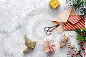 Prepare new year and christmas 2018 presents in boxes and envelopes on stone background top veiw mockup