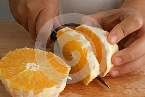 Prepare one orange to make fruitsalad