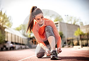 Prepare before running. Young woman.