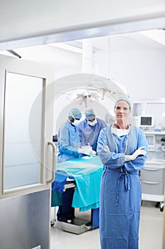 Prepared for any eventuality. Portrait of a mature doctor waiting in the enterance of a doorway to an operating room.