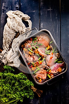 Prepared for baking chicken meat with vegetables