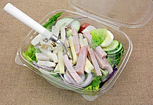 Prepared Chef Salad With Fork On Burlap Cloth