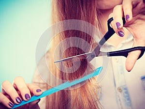 Prepared girl to cut her long straight hair.