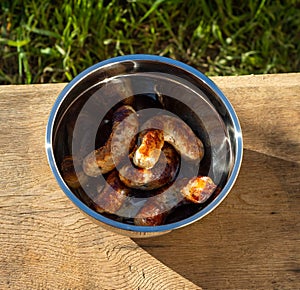 Prepared grilled sausages on grill