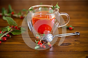 Prepared hot drink from ripe goji berries in a glass cup