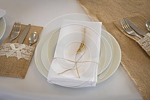 Prepared table with plates and napkin