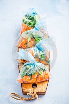 Prepared vegetable bags for freezer. Frozen food, food preservation concept