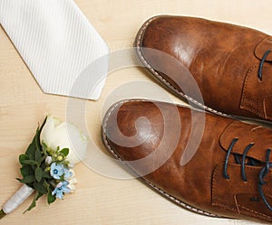 Prepared for wedding - detail of shoes, tie and Boutonniere flower