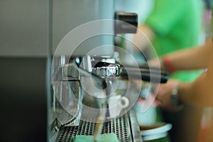 Prepares espresso in his coffee shop, close-up