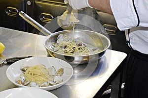 Preparetion dish of spaghetti with clams photo