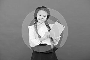 Preparing activity book writing. Reading skills. Study language. Interesting story. Adorable little girl with school