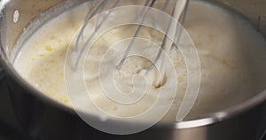 Preparing bechamel sauce milk pour
