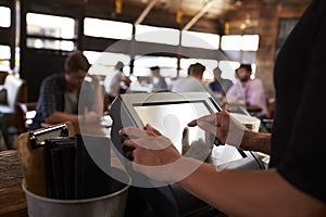 Preparing the bill at a restaurant using a touch screen till