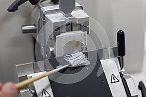 Preparing a biopsy by use Microtome in Lab.