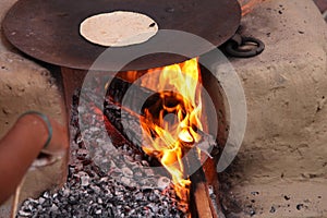 Preparing Chapathi bread in a village, Uttar Pradesh, India