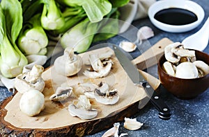 Preparing for chinese meal. Cooking Ingredients: bok choy, mushrooms, garlic and soy sauce.