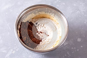 Preparing chocolate dough for pie flour and cocoa