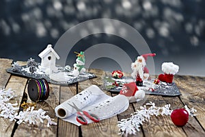 Accessories, Preparing for Christmas. Holiday decoration on slate squares, toys, garlands, on blue,and blur light ,top