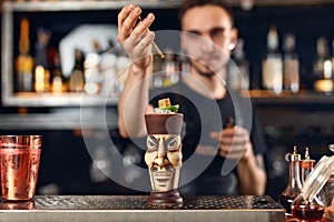 Preparing Cocktails. Bartender Making Cocktail In Bar