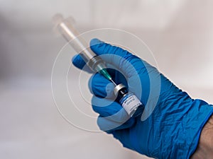 Preparing COVID-19 vaccine for injection photo