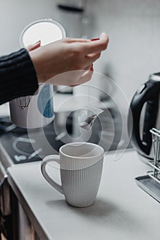 Preparing a cup of tea in the kitchen