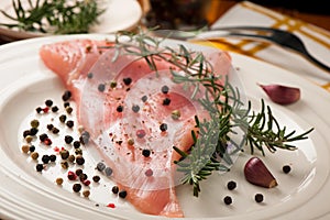 Preparing delicious stake for dinner - raw fillet of turkey meat