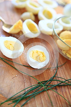 Preparing deviled eggs with fresh chives