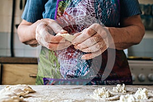 Preparing dumplings filled with cottage cheese