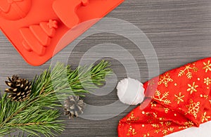 Preparing festive treats for Christmas and new year holidays. red Santa hat and cookie cutters