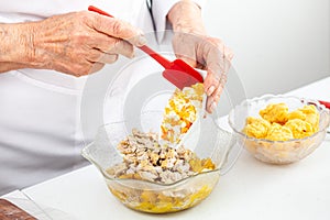 Preparing the filling for a traditional dish from el Valle del Cauca in Colombia called empanada