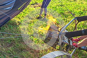 Preparing for a flight in a hot air balloon.A burner with its super hot flame light up inside of a hot air balloon