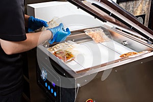 Preparing food bags in vacuum sealer appliance