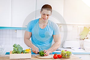 Preparing food cut vegetables young man healthy meal kitchen eat