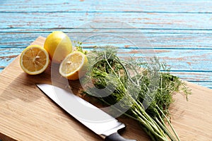 Preparing food for sauce salad by ingredient is lemon and coriander on wood block