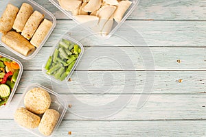 preparing food for the week. A stack of homemade meals in containers ready to be frozen for later use