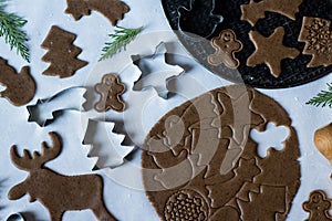 Preparing homemade cookies for Christmas in different shapes,work in progress. Traditional dessert. Holiday background. Top view