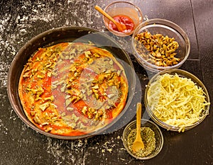 Preparing homemade vegetarian pizza with cheese and mushrooms